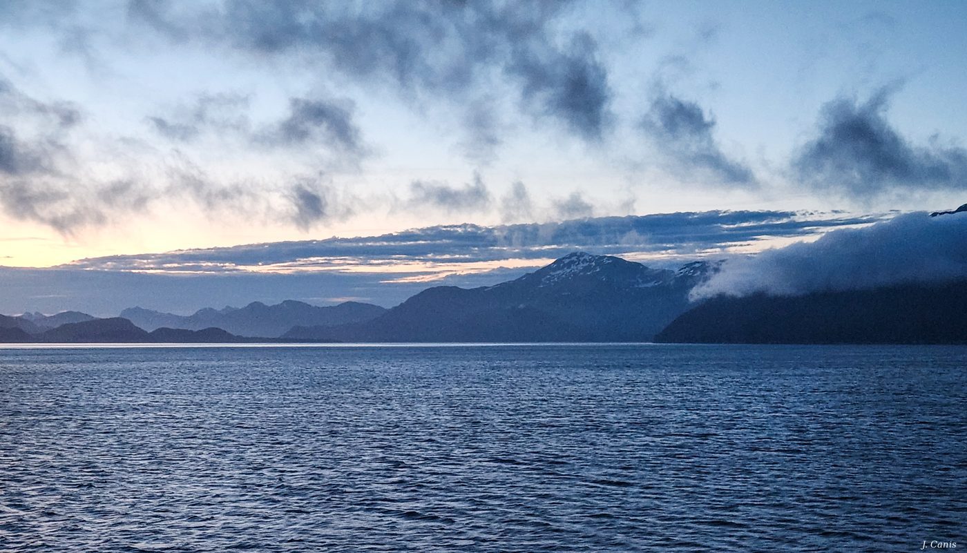 Alaska Blue — deep blue Arctic light over Inside Passage mountains, color photography by Jon Canis