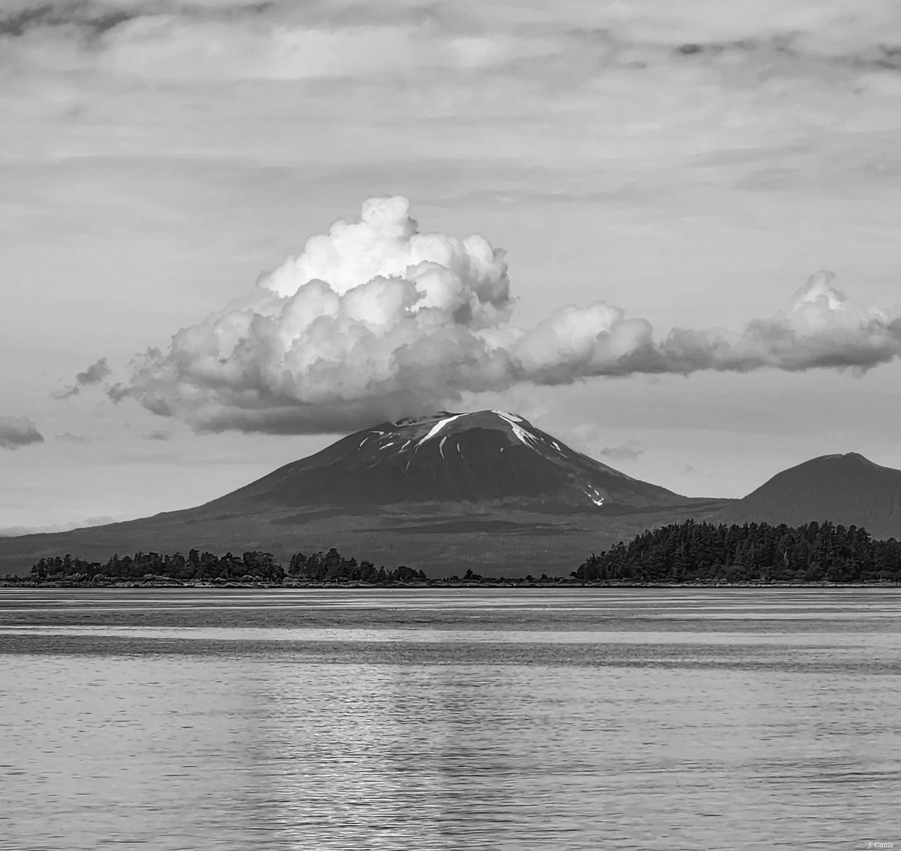 Alaska Cloud Peak — snow-capped mountain with dramatic cumulus cloud, Inside Passage black and white photography by Jon Canis