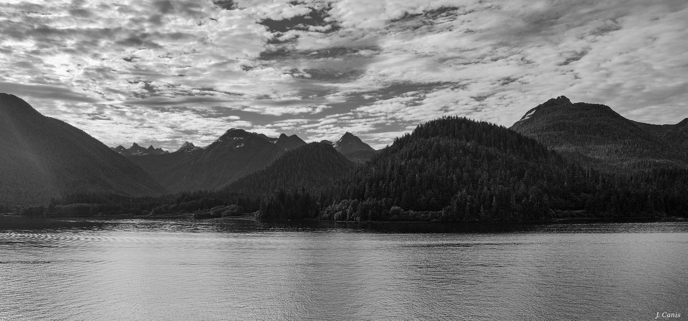 Alaska Layered Peaks — receding mountain ranges beneath mackerel sky, Inside Passage black and white photography