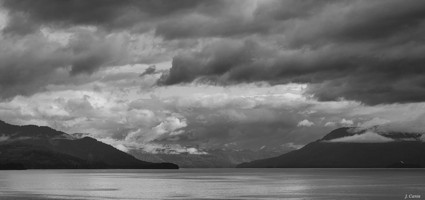 Alaska Cloudy and Still — brooding storm clouds over Inside Passage waters, Alaska black and white photography by Jon Canis