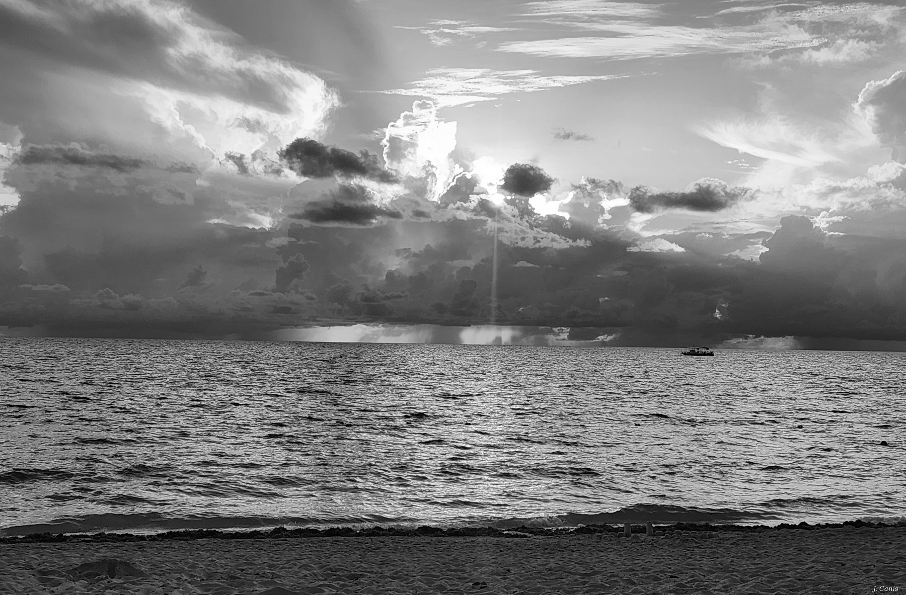 Cayman Storm — tropical storm cell building over Caribbean waters, black and white photography by Jon Canis