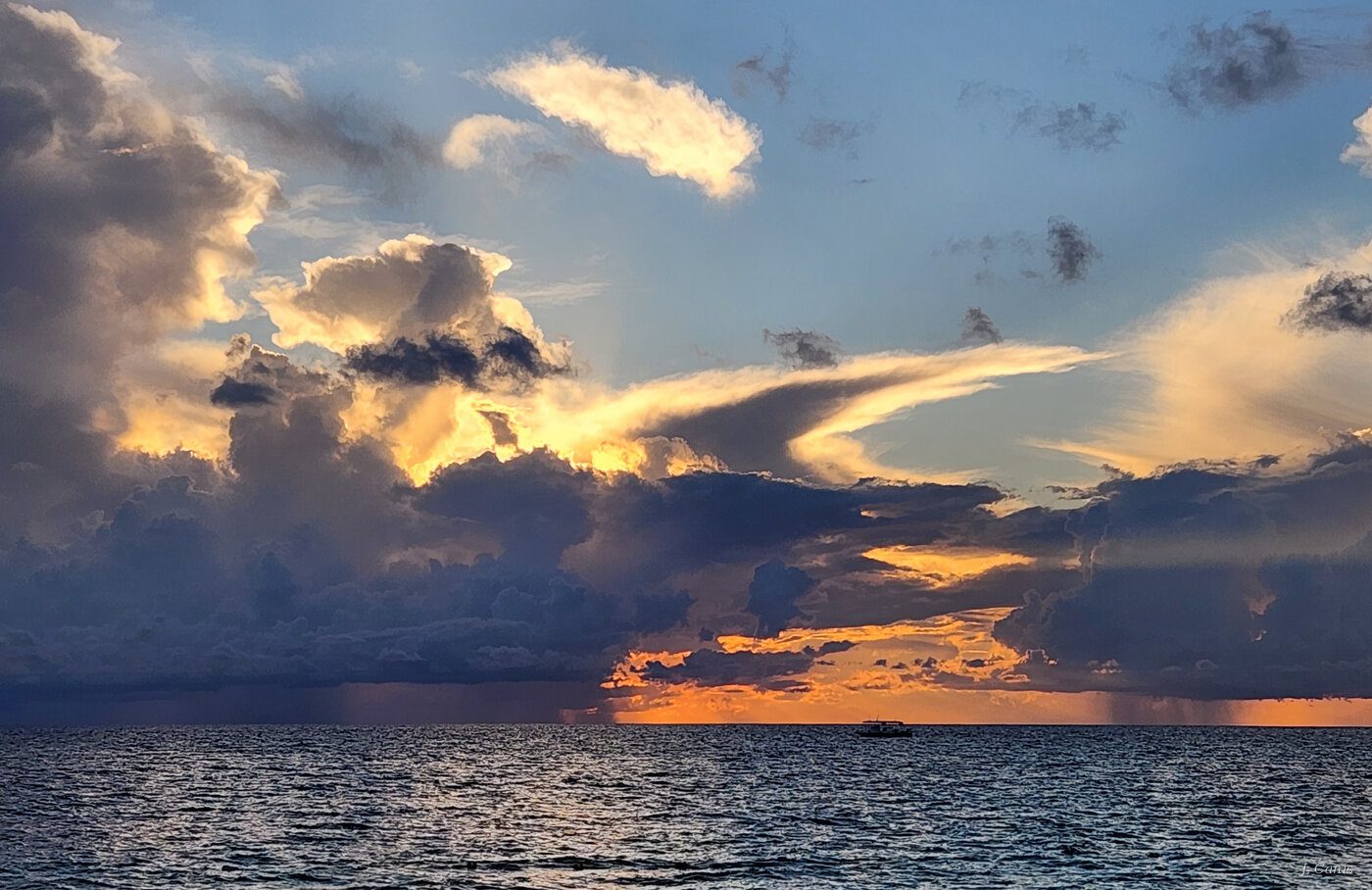 Cayman Storm Clouds — towering storm clouds at sunset over Caribbean, Cayman Islands photography by Jon Canis